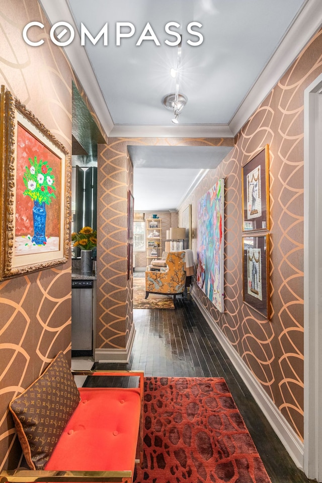 hall with ornamental molding and wood-type flooring
