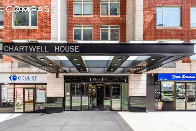property entrance with brick siding