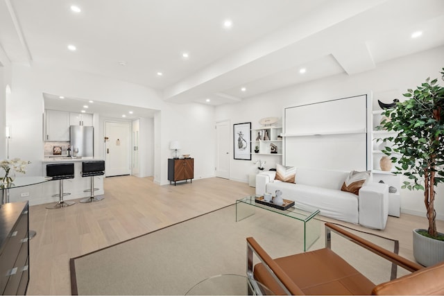 living room featuring light wood finished floors and recessed lighting