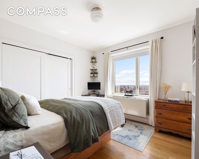 bedroom with light wood-style floors