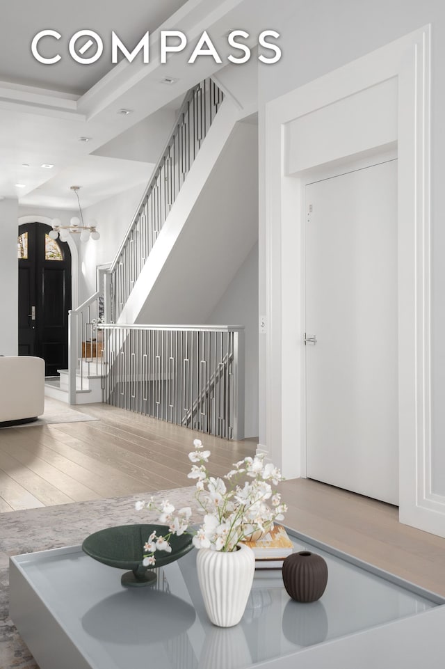 interior space featuring a chandelier and wood finished floors
