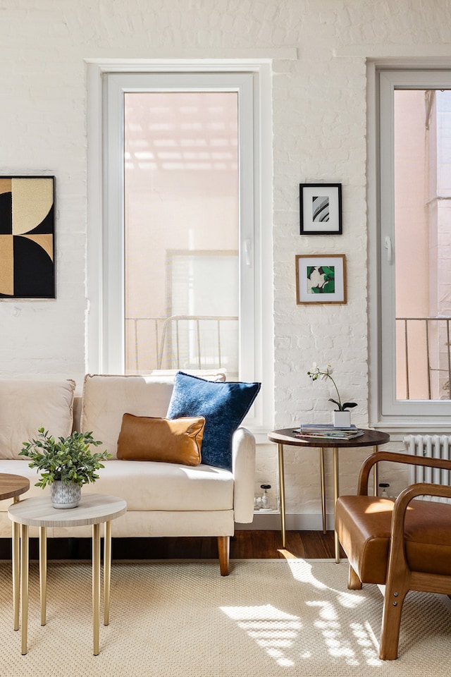 sitting room featuring radiator heating unit and wood finished floors