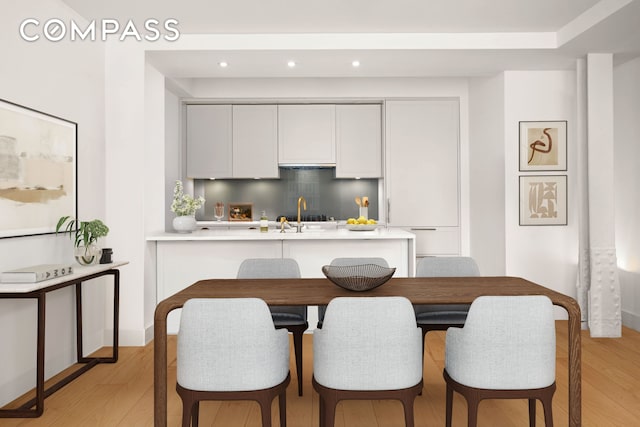 kitchen featuring light countertops, recessed lighting, and light wood-type flooring