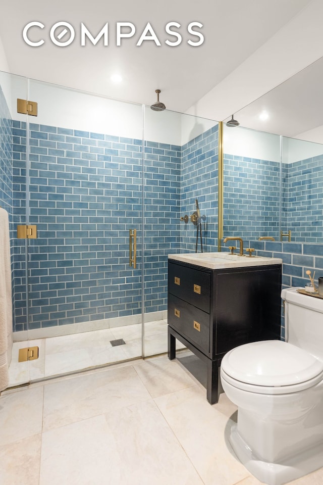 bathroom with tile patterned flooring, a stall shower, toilet, and tile walls