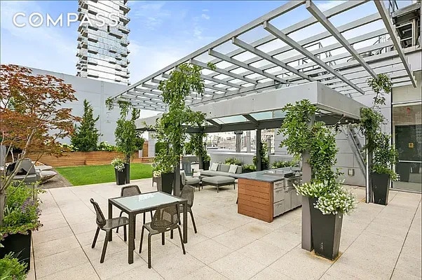 view of patio featuring fence, a pergola, outdoor dining area, and an outdoor living space