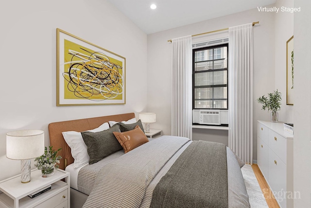 bedroom with recessed lighting, baseboards, and cooling unit
