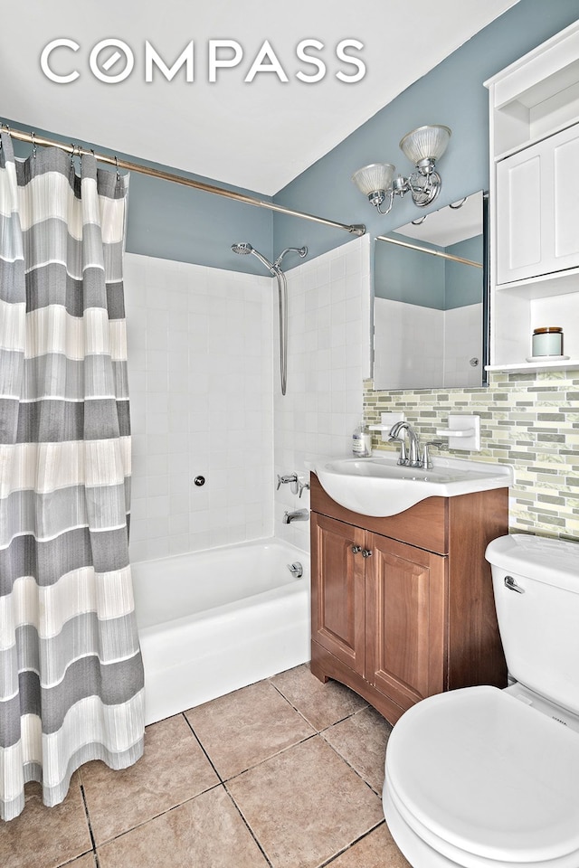 full bath with shower / bath combo with shower curtain, vanity, toilet, tile patterned floors, and backsplash
