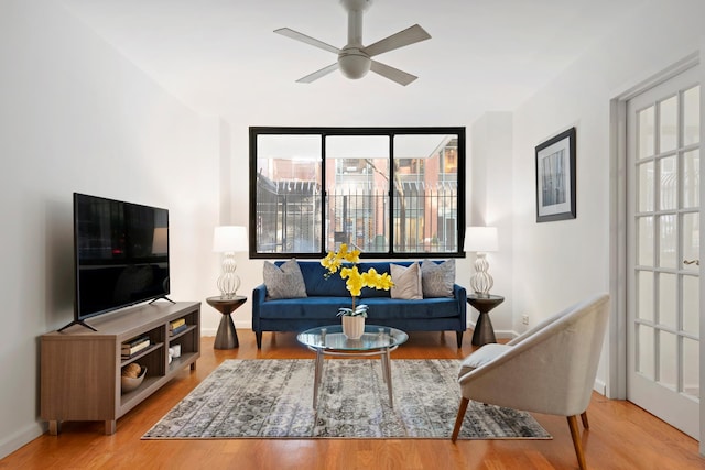 16 W 16th St Unit 1Ds, New York City, NY 10011 - living area with wood finished floors, ceiling fan, healthy amount of natural light, and baseboards