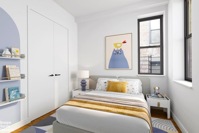 bedroom with a closet and wood finished floors
