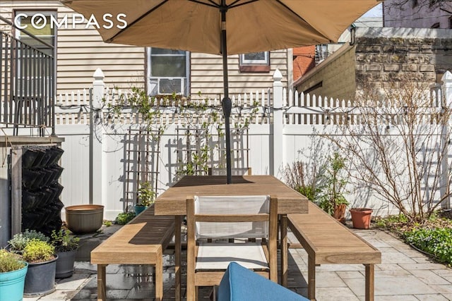 view of patio featuring outdoor dining area