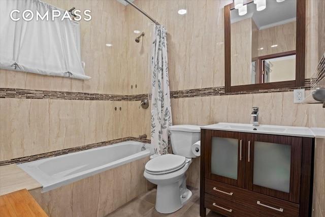 bathroom featuring vanity, toilet, tile walls, tiled shower / bath, and tile patterned floors