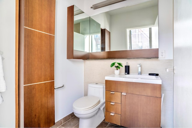 148 E 24th St Unit 15C, New York City, NY 10010 - half bath featuring toilet, tile patterned flooring, vanity, and tile walls