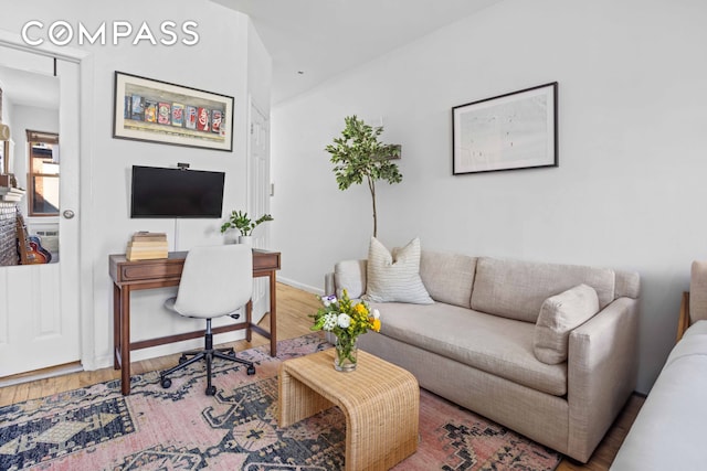 office with baseboards and wood finished floors