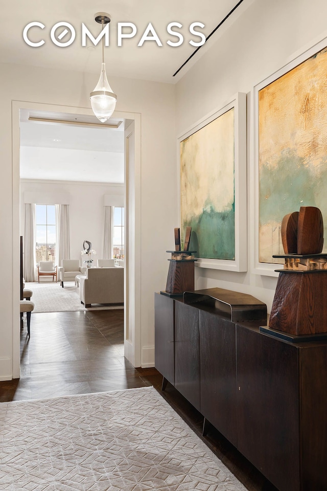hall featuring baseboards