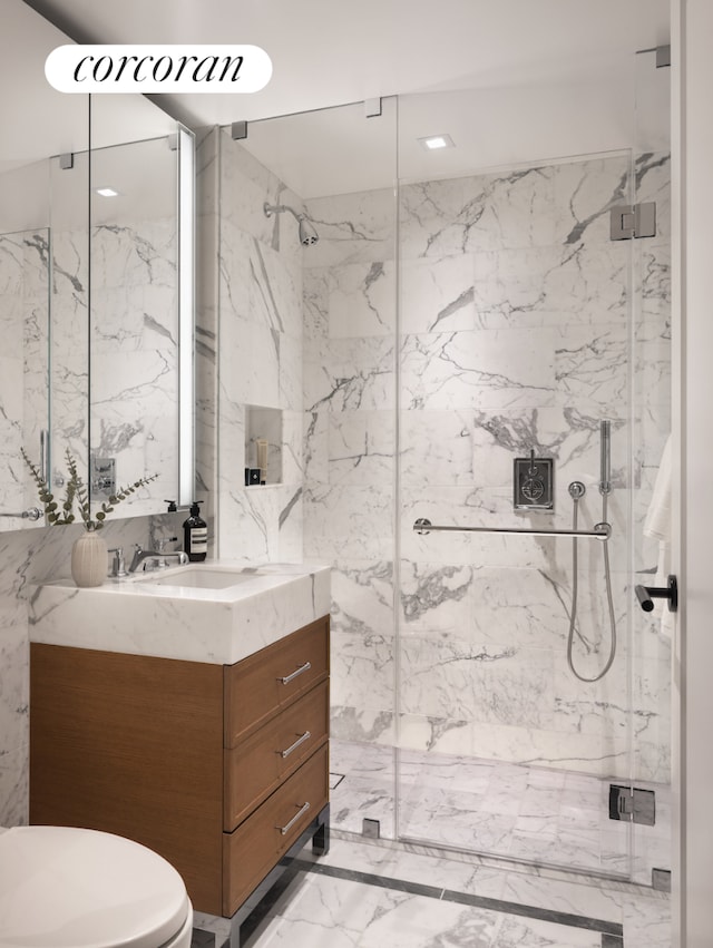 bathroom with vanity, marble finish floor, toilet, recessed lighting, and a marble finish shower
