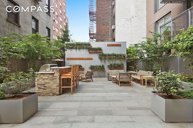 view of patio / terrace with exterior kitchen and outdoor dry bar