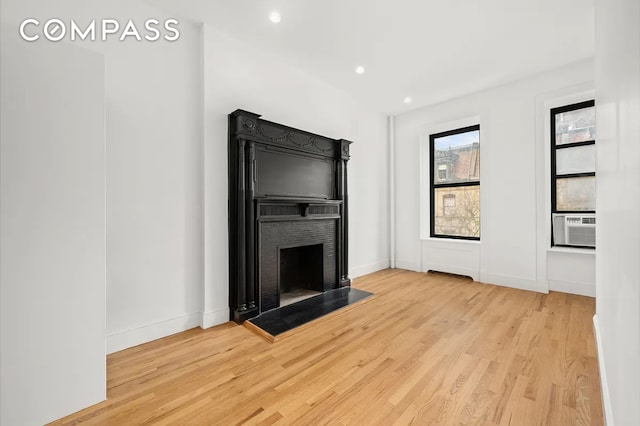 130 W 80th St Unit 4F, New York City, NY 10024 - unfurnished living room featuring wood finished floors, a fireplace, and recessed lighting