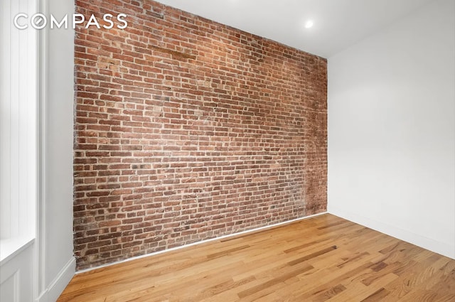 130 W 80th St Unit 4F, New York City, NY 10024 - empty room featuring brick wall and wood finished floors