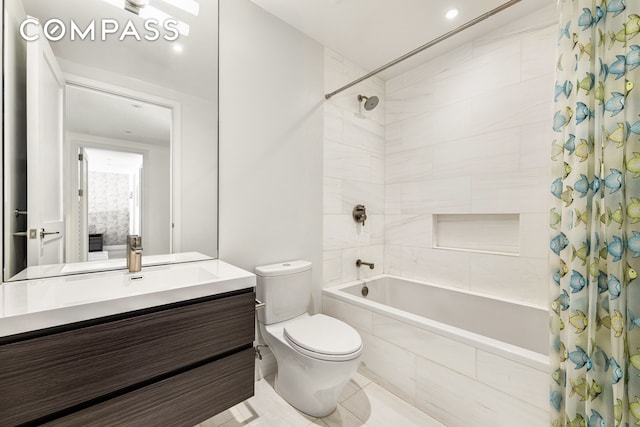 bathroom with tiled shower / bath combo, toilet, and vanity