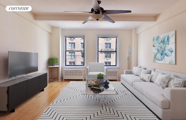 40 W 72nd St Unit 62, New York City, NY 10023 - living room featuring radiator, beam ceiling, a ceiling fan, and light wood-style flooring