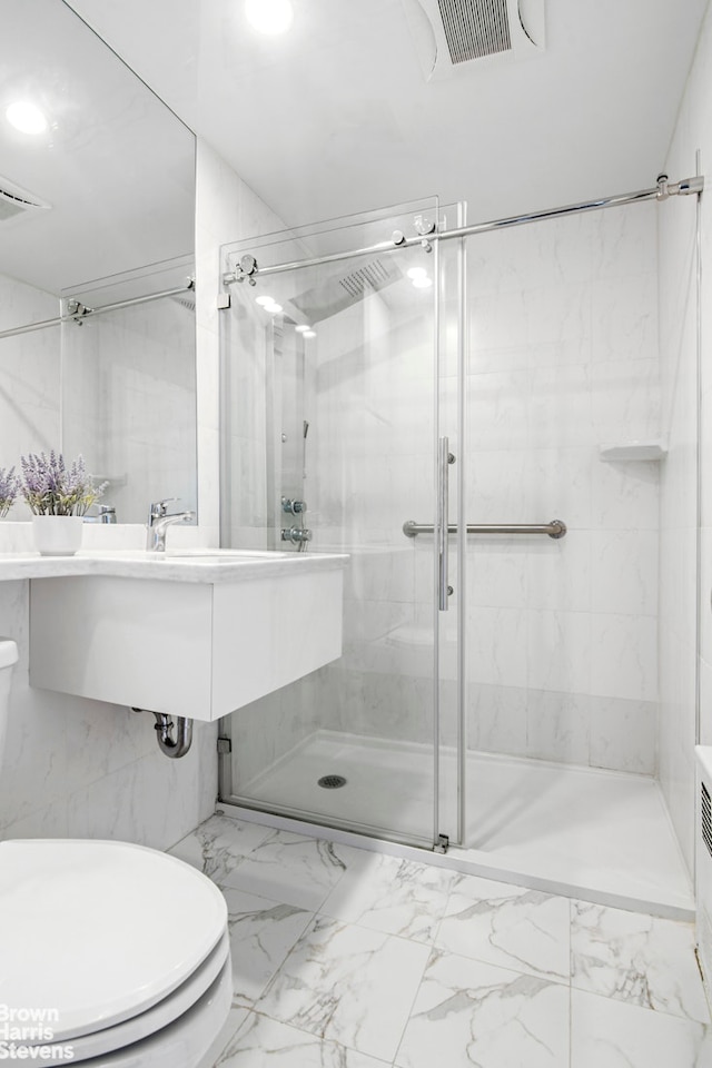 full bath with visible vents, marble finish floor, a stall shower, and toilet