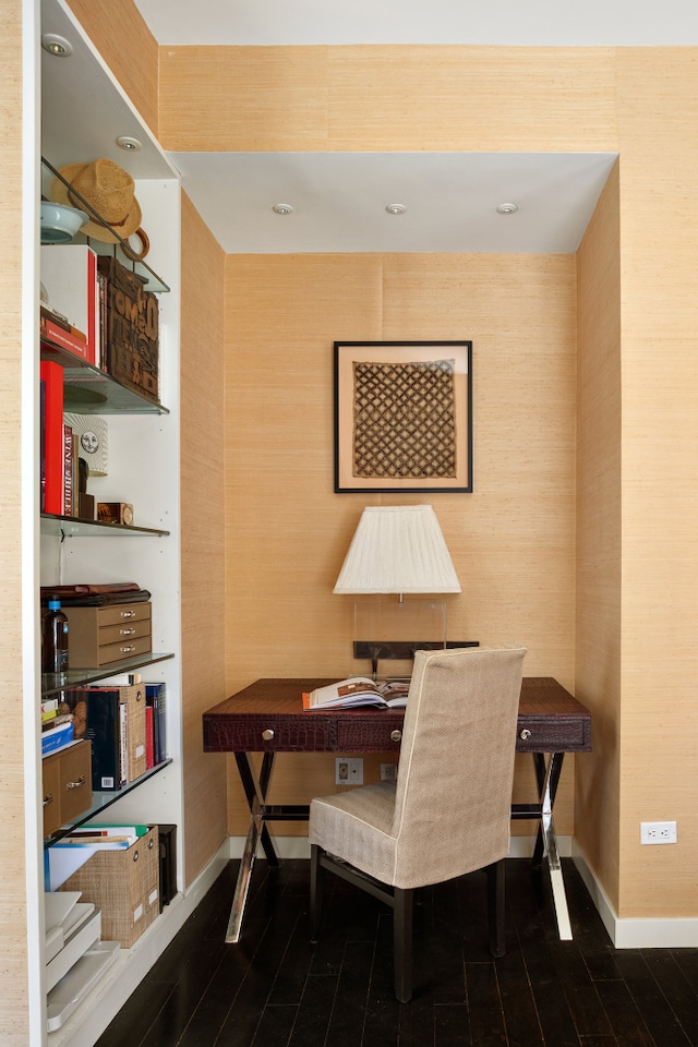 office space featuring baseboards and dark wood-type flooring