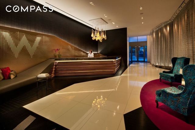123 Washington St Unit 52F, New York City, NY 10006 - welcome area featuring a chandelier