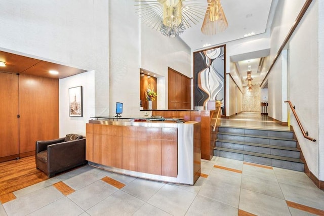 65 W 13th St Unit 9B, New York City, NY 10011 - welcome area featuring a towering ceiling, stairs, a chandelier, and recessed lighting
