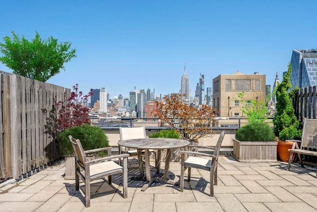 65 W 13th St Unit 9B, New York City, NY 10011 - view of patio / terrace featuring a skyline view, outdoor dining space, and fence