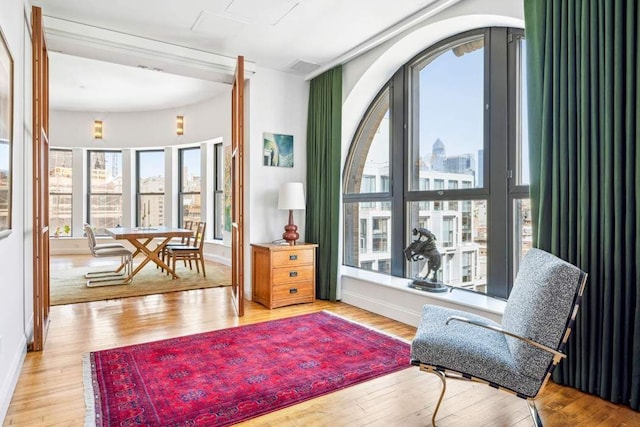 65 W 13th St Unit 9B, New York City, NY 10011 - sitting room featuring wood-type flooring and baseboards