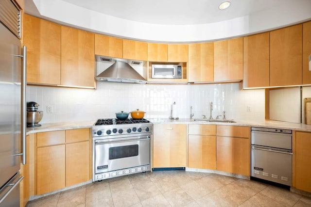 65 W 13th St Unit 9B, New York City, NY 10011 - kitchen featuring premium appliances, wall chimney range hood, a sink, tasteful backsplash, and light tile patterned floors