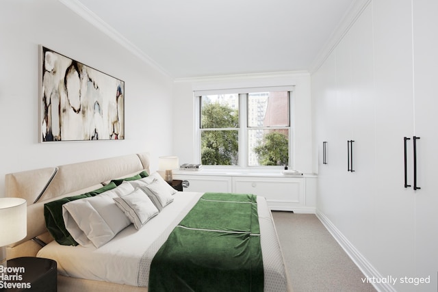 bedroom featuring crown molding, carpet floors, and baseboards