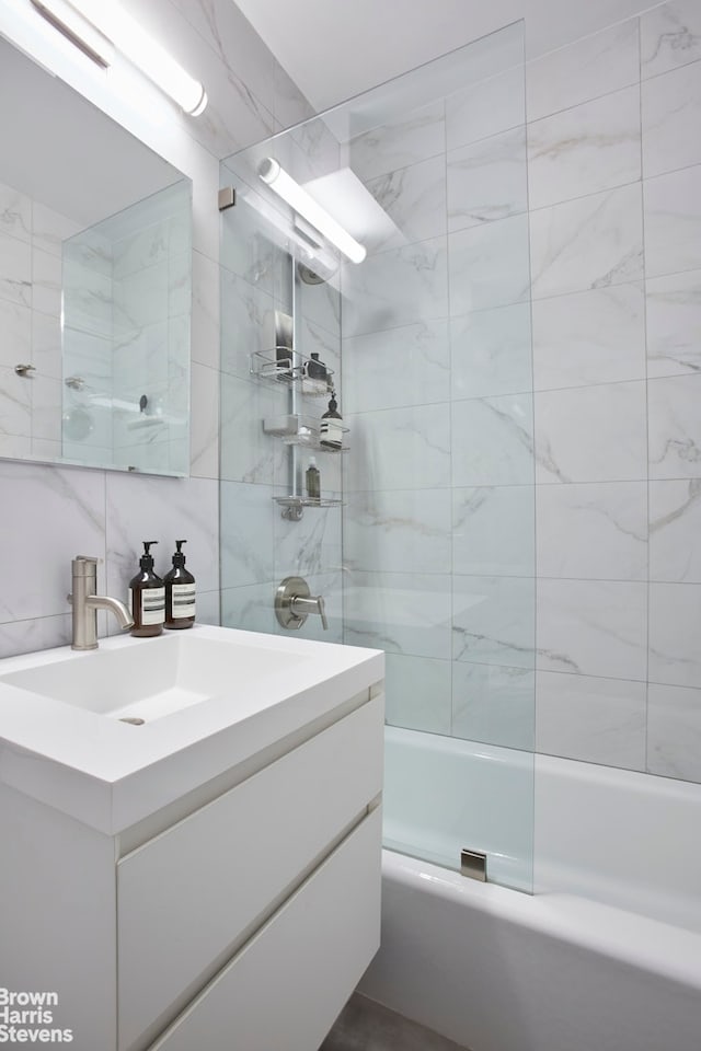 64 E 94th St Unit 4C, New York City, NY 10128 - bathroom with vanity, tile walls, and  shower combination