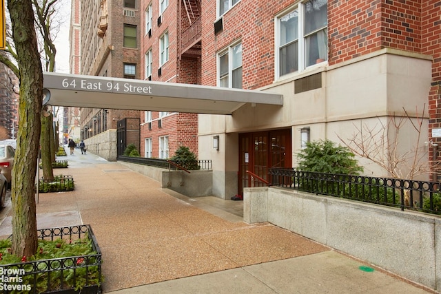 exterior space with brick siding