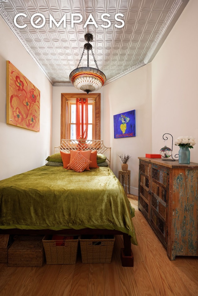 331 W 89th St Unit 2B, New York City, NY 10024 - bedroom featuring an ornate ceiling, ornamental molding, and wood finished floors