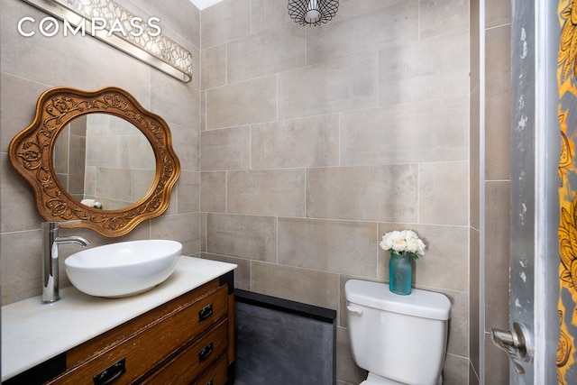 331 W 89th St Unit 2B, New York City, NY 10024 - bathroom featuring tile walls, vanity, and toilet