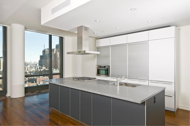 kitchen featuring a sink, extractor fan, appliances with stainless steel finishes, modern cabinets, and white cabinets