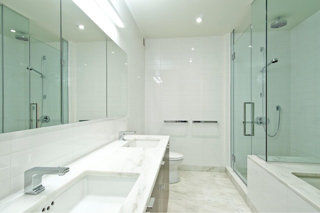 full bathroom with a stall shower, toilet, recessed lighting, double vanity, and a bath