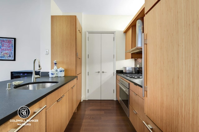 70 Little W St Unit 5C, New York City, NY 10280 - kitchen featuring a sink, stainless steel appliances, wall chimney range hood, dark countertops, and dark wood-type flooring