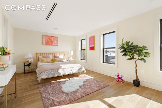 198 Madison St Unit Sf, New York City, NY 11216 - bedroom with light wood-type flooring and baseboards