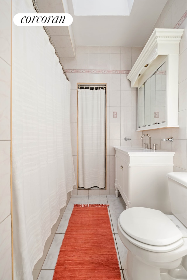 full bathroom featuring tile walls, tile patterned flooring, vanity, and toilet