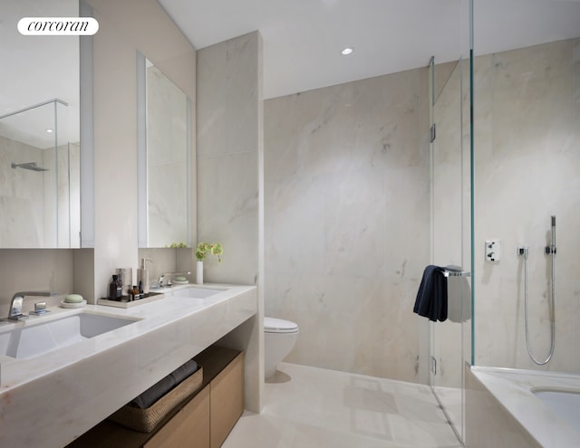 full bath featuring toilet, a shower with door, tile walls, and a sink