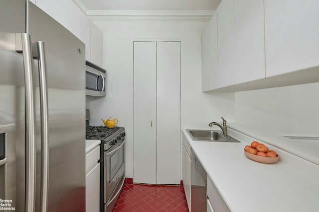 101 W 79th St Unit 2G, New York City, NY 10024 - kitchen featuring stainless steel appliances, white cabinetry, light countertops, ornamental molding, and dark tile patterned flooring