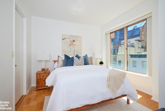 bedroom with baseboards and access to exterior