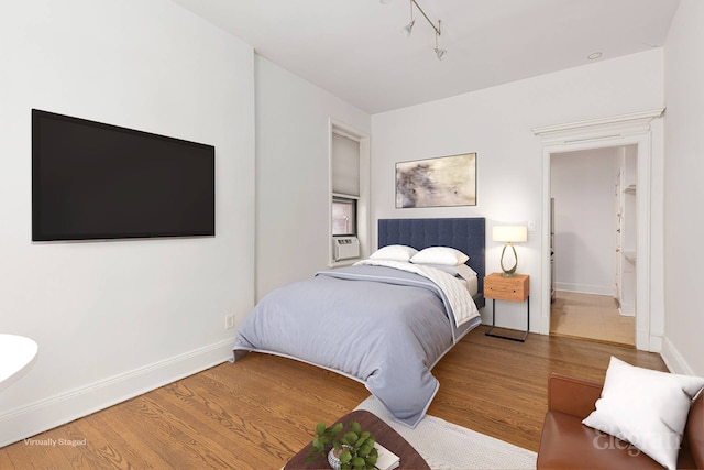 175 Amity St Unit A4, New York City, NY 11201 - bedroom with wood finished floors, baseboards, and track lighting