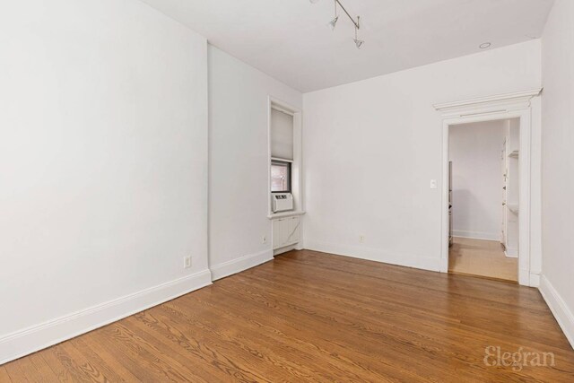 175 Amity St Unit A4, New York City, NY 11201 - spare room featuring wood finished floors, baseboards, and track lighting