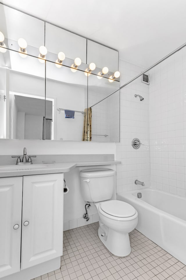 bathroom featuring shower / bathing tub combination, visible vents, tile patterned flooring, vanity, and toilet