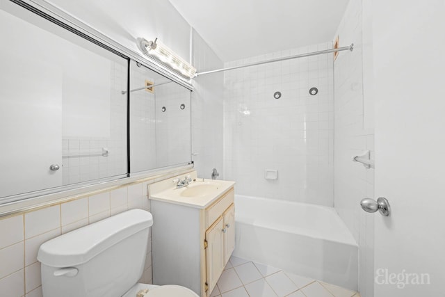bathroom with toilet, tile patterned floors, tub / shower combination, and vanity