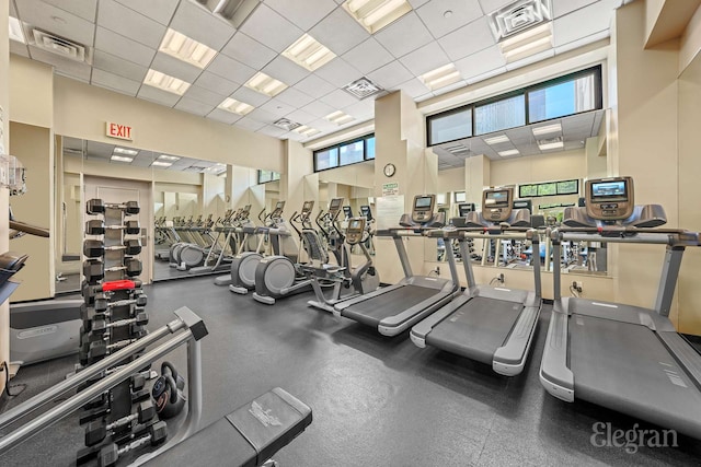 exercise room with visible vents and a drop ceiling