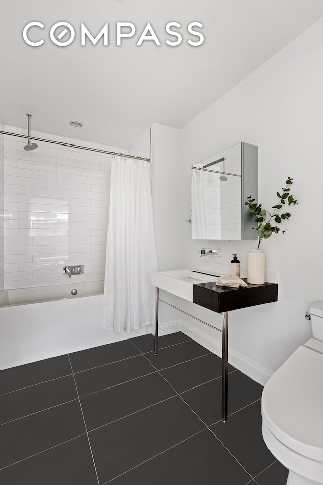 245 10th Ave Unit 2W, New York City, NY 10001 - full bath with tile patterned floors and shower / bath combo with shower curtain